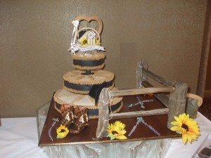 Center Post Wagon Wheel Cake w/ Hand Made Split Rail Fence and Cowboy Boot Accents
